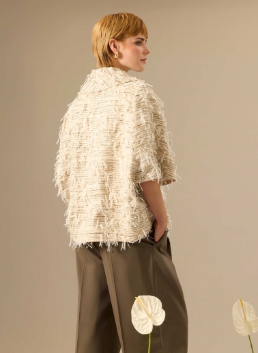 Oversized beige cape with fringes