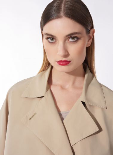 Double breasted beige cape in rainproof technical fabric