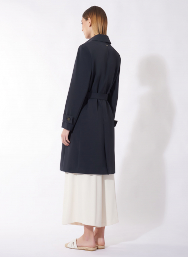 Single breasted blue trench coat in technical fabric with hand stitches