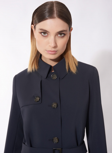 Single breasted blue trench coat in technical fabric with hand stitches