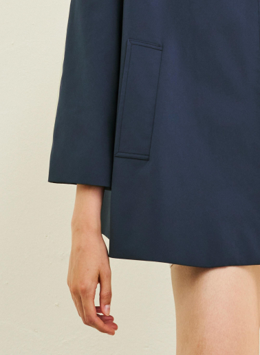 Flared marine blue jacket in rainproof technical fabric