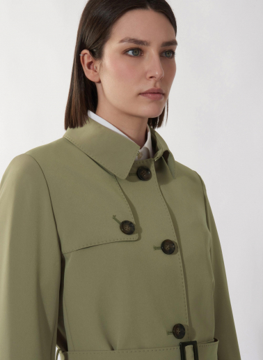 Single breasted military green trench coat in  technical fabric with hand stitches