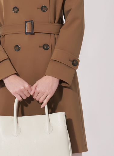 Double breasted tobacco color trench coat in technical fabric