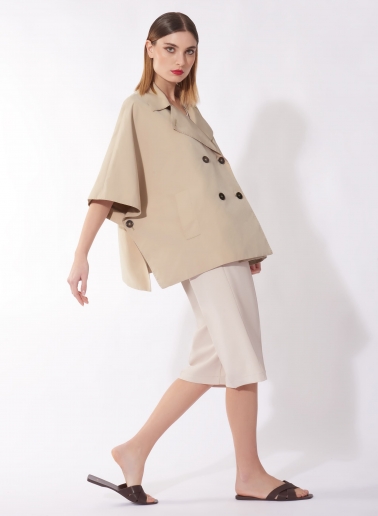 Double breasted beige cape in rainproof technical fabric